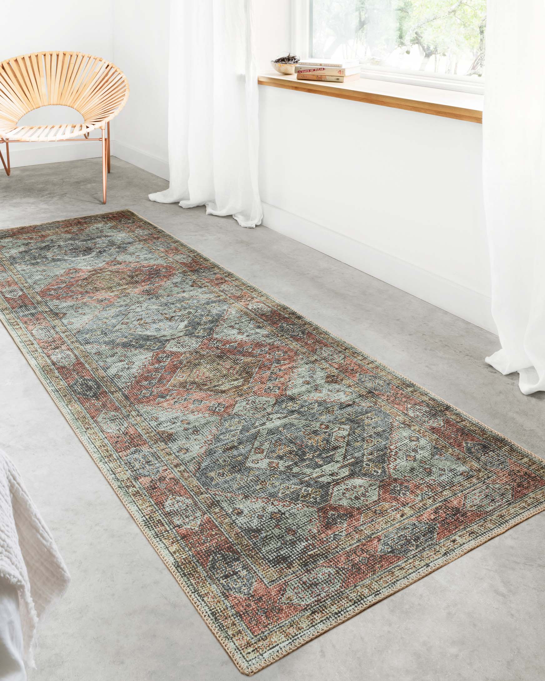 Long apricot and mist rug runner with border and distressed geometric medallion design