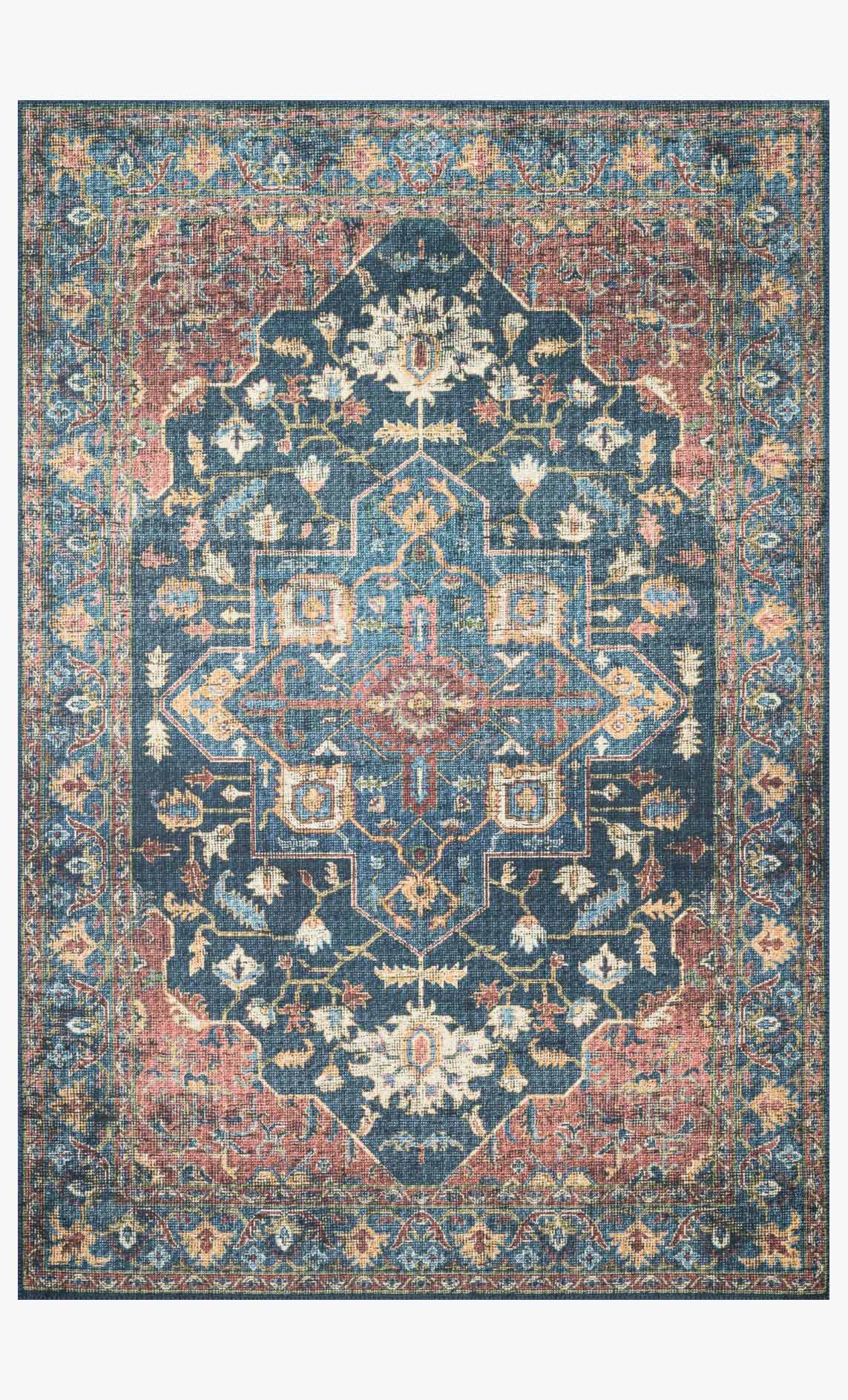Traditional power-loomed rug with medallion pattern in denim blue and brick red