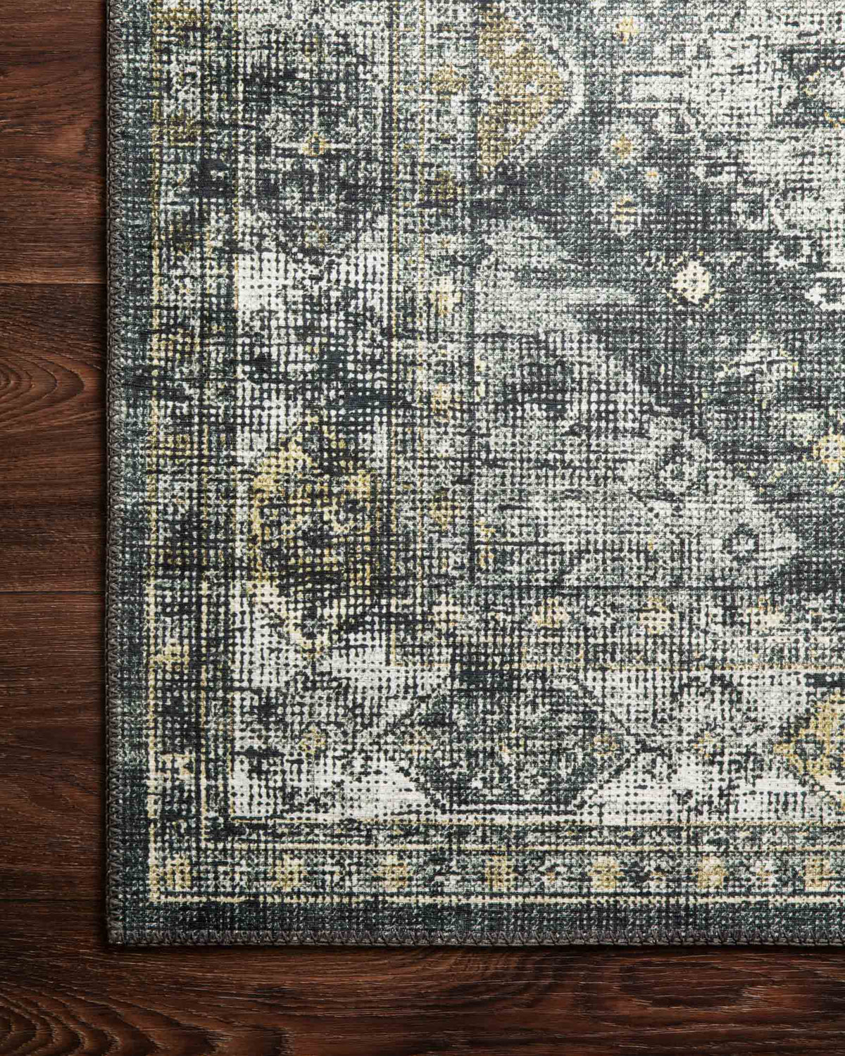 Graphite and silver rug texture with dense woven pattern and faint gold speckling