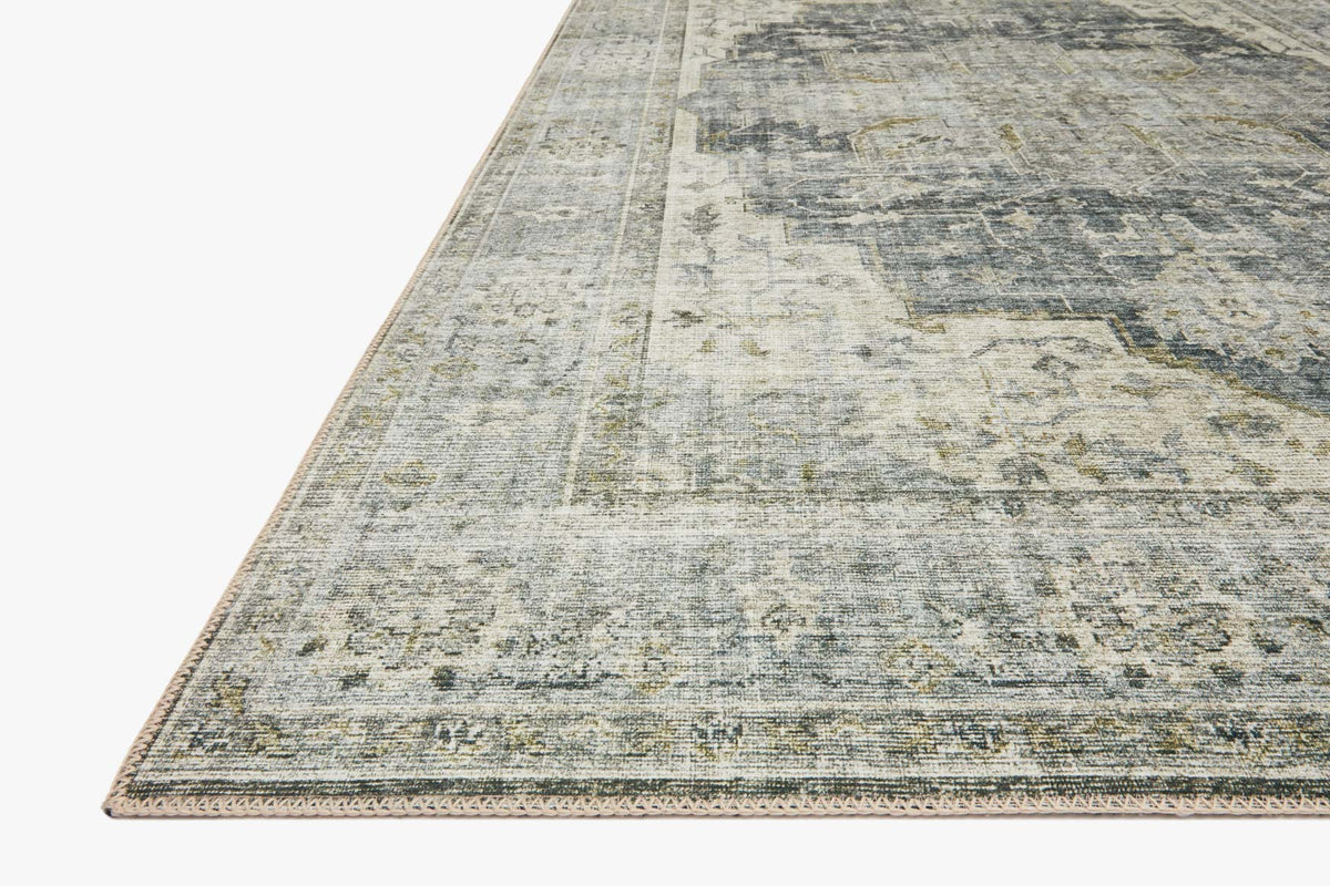 Traditional power-loomed rug corner view with charcoal-and-dove distressed pattern