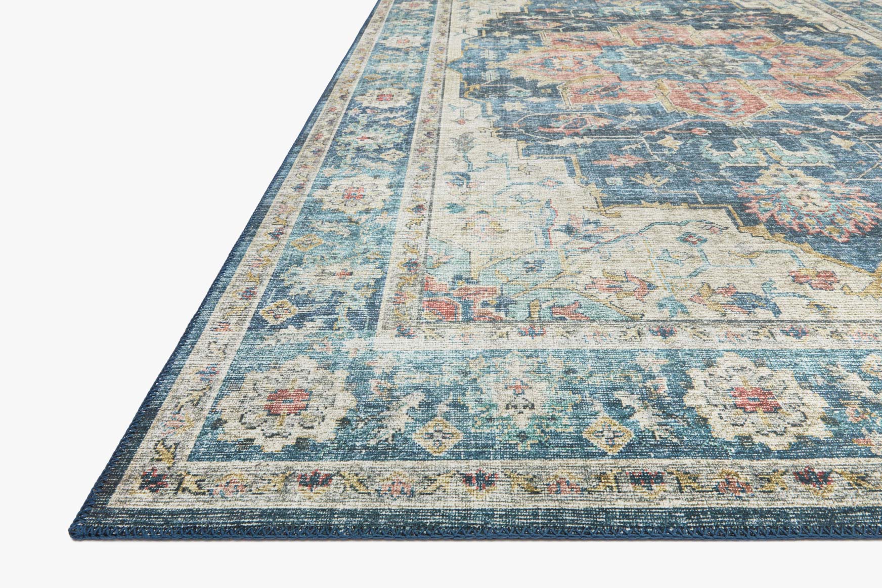 Ocean-blue traditional rug with border and distressed geometric pattern