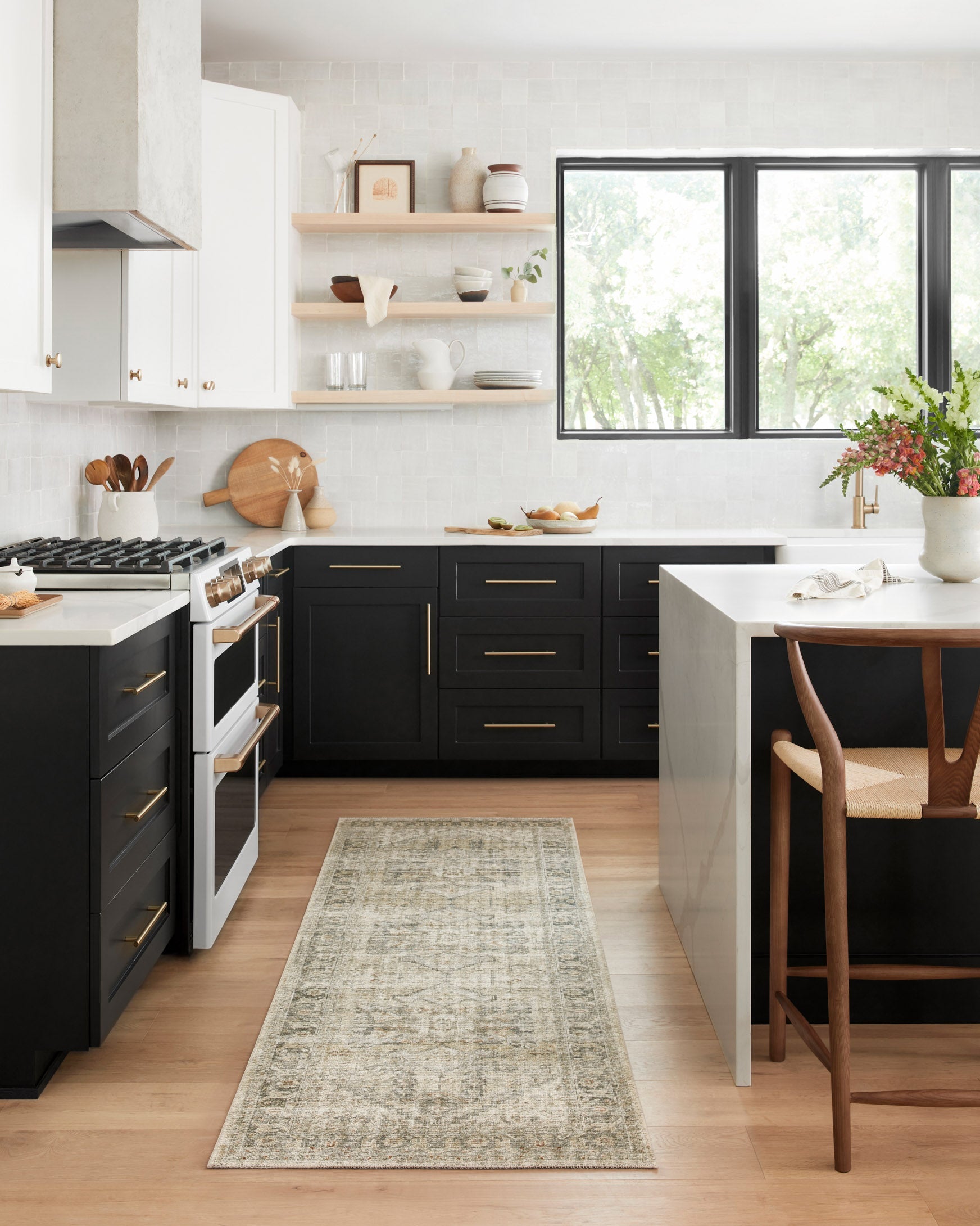 Natural sand rug with distressed geometric motif runner in a modern kitchen