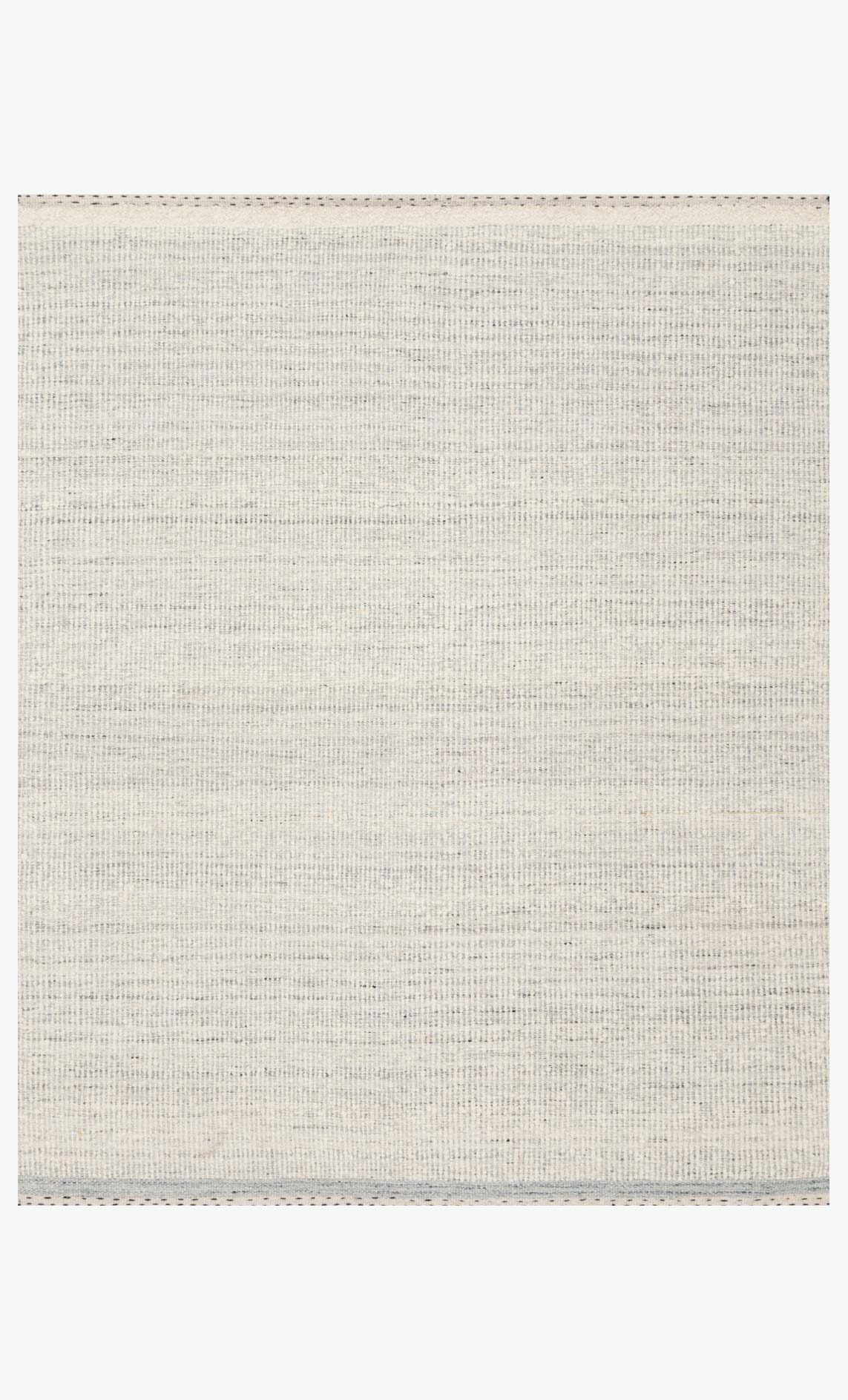 Hand-woven contemporary rug in mist with flat woven texture and subtle border