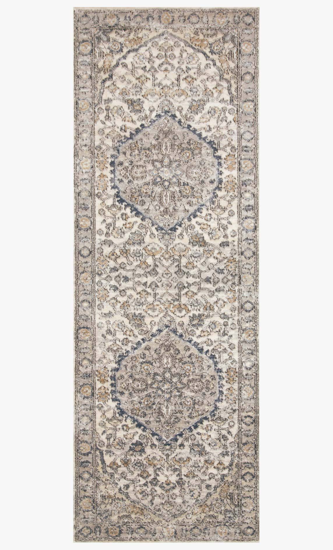 Natural and light gray rug with two medallion panels and decorative border