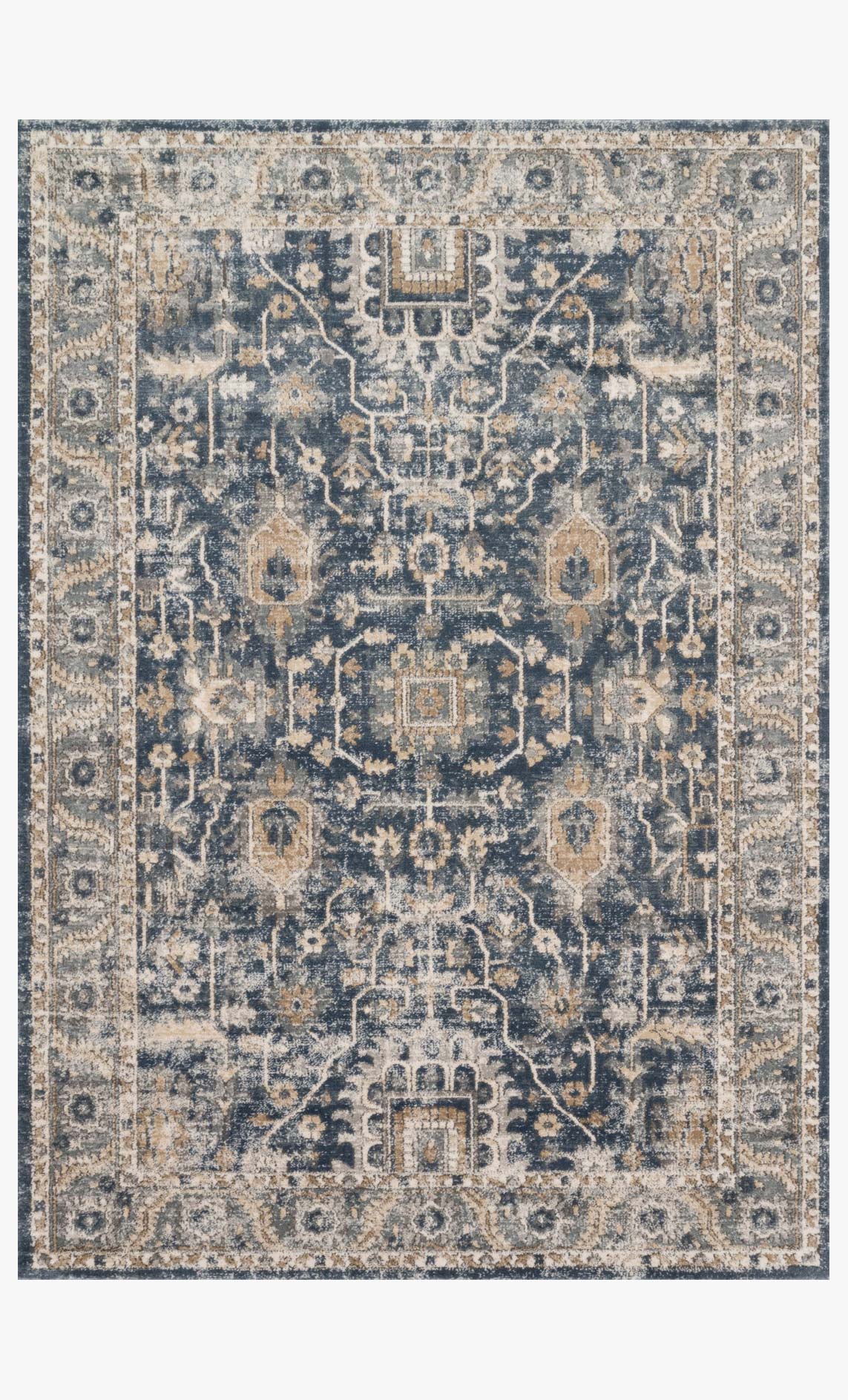Power-loomed rug with denim blue and pebble abstract medallion pattern border.