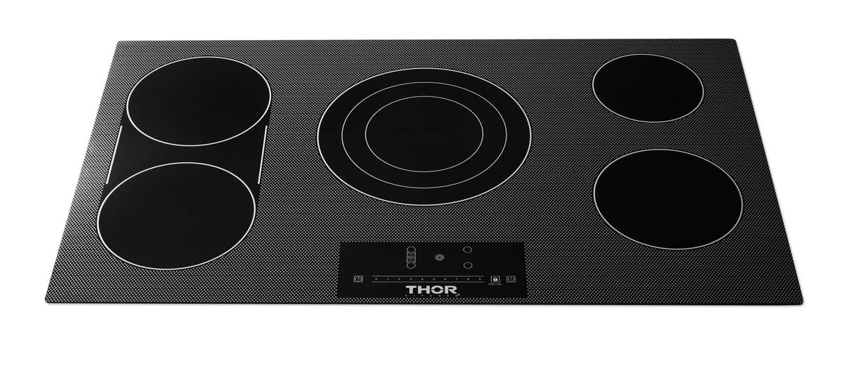 Black glass electric cooktop with five round burner zones and center control panel