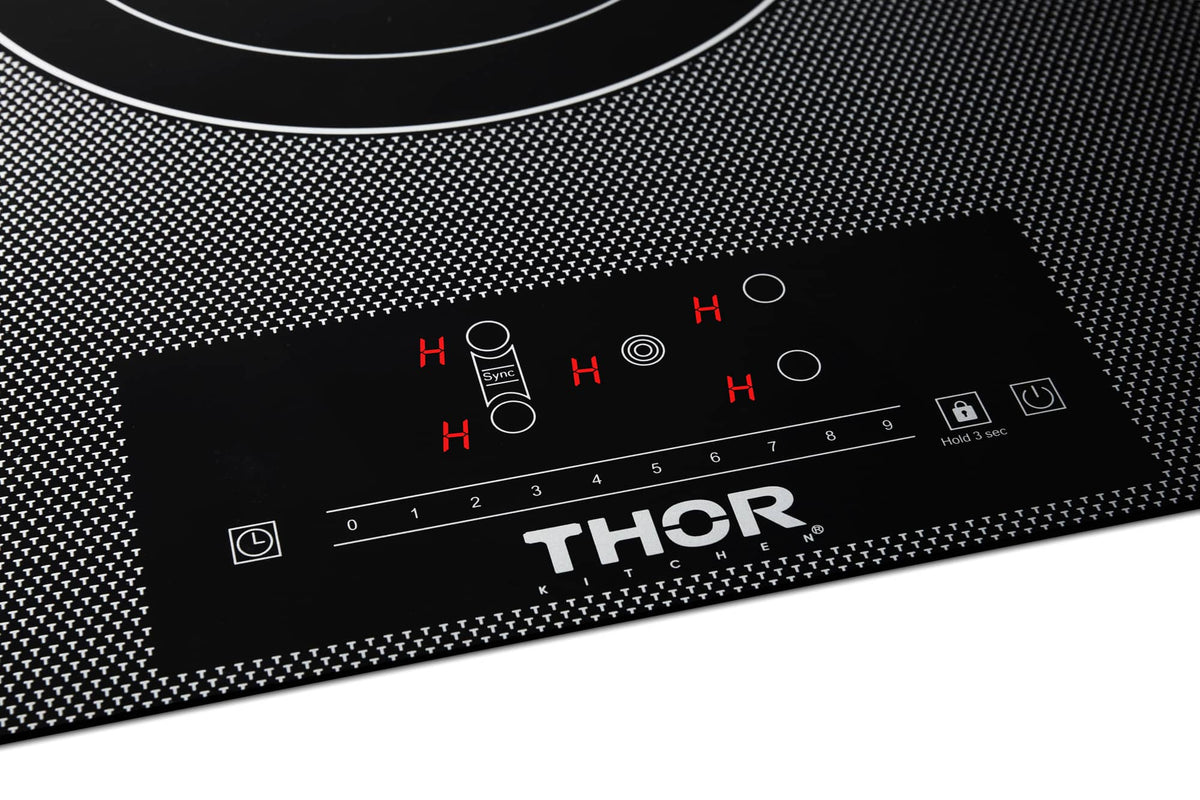Black electric cooktop control panel showing red heat indicators and touch controls