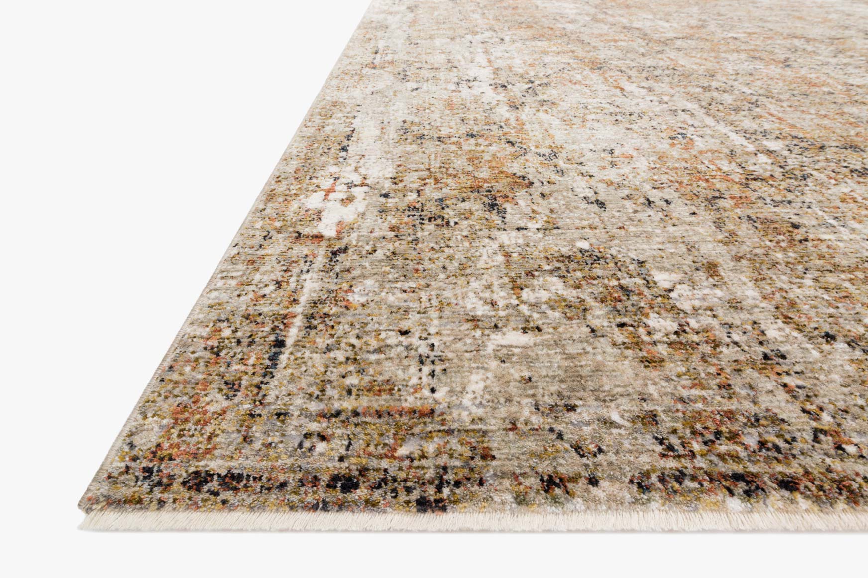 Area rug in taupe and gold shown from the corner, textured abstract distressed design