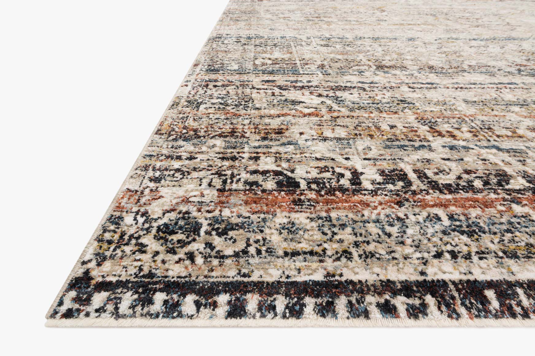 Corner view of taupe area rug with cream base and multicolor distressed stripes