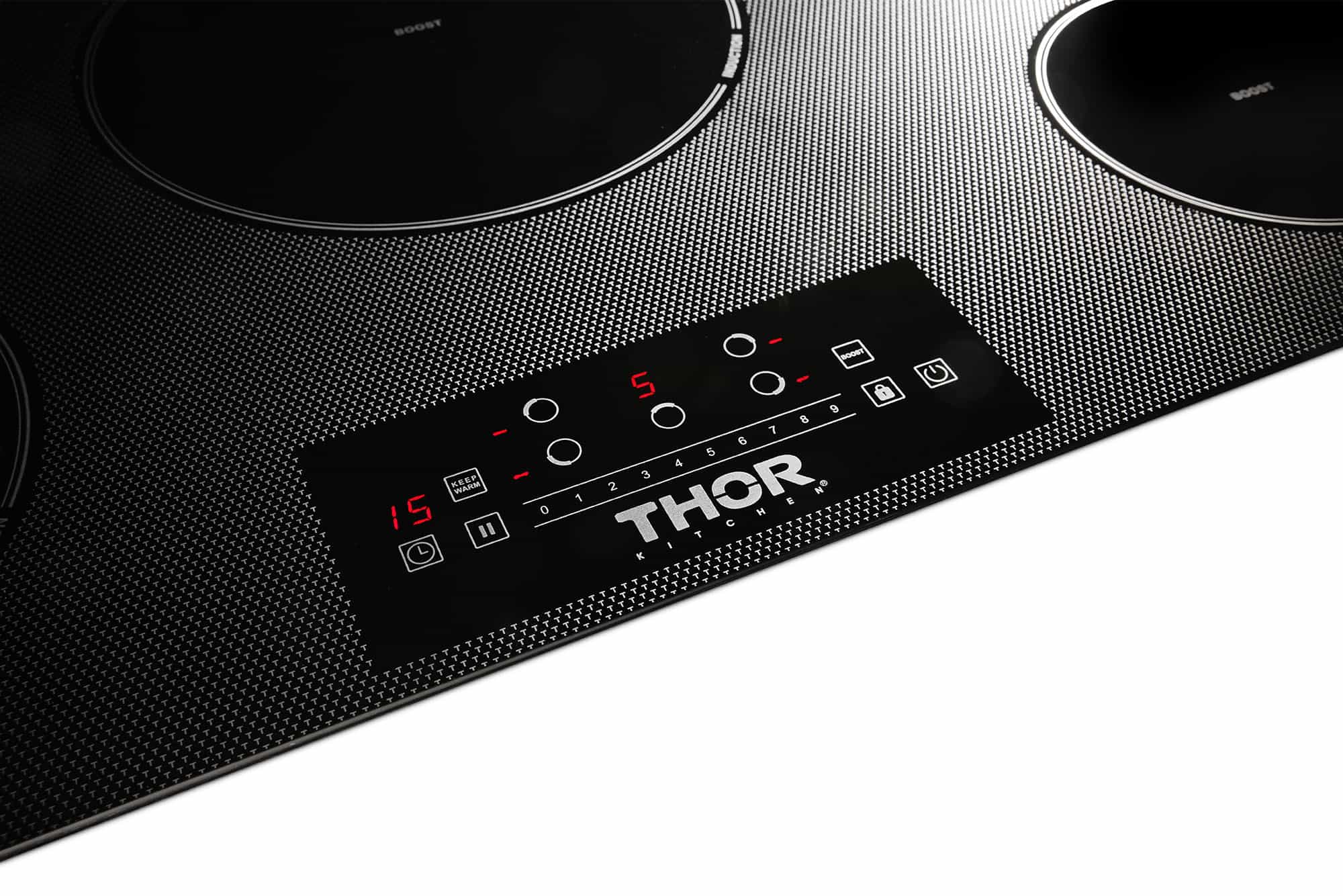 Black induction cooktop control panel showing red lit indicator on front buttons