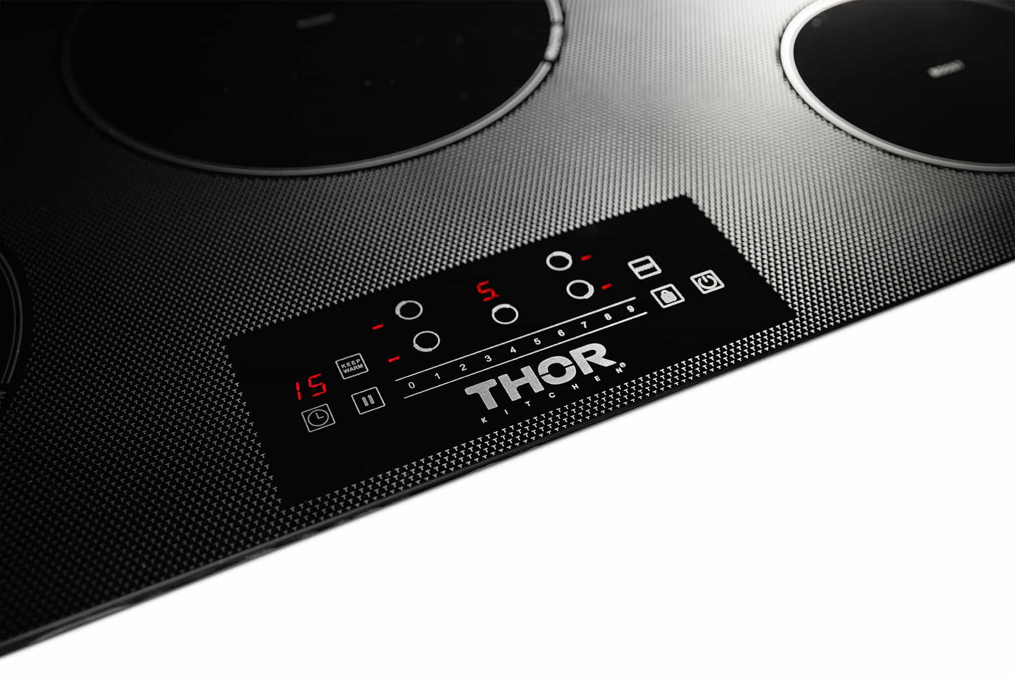Black induction cooktop control panel with one red lit setting and touch controls