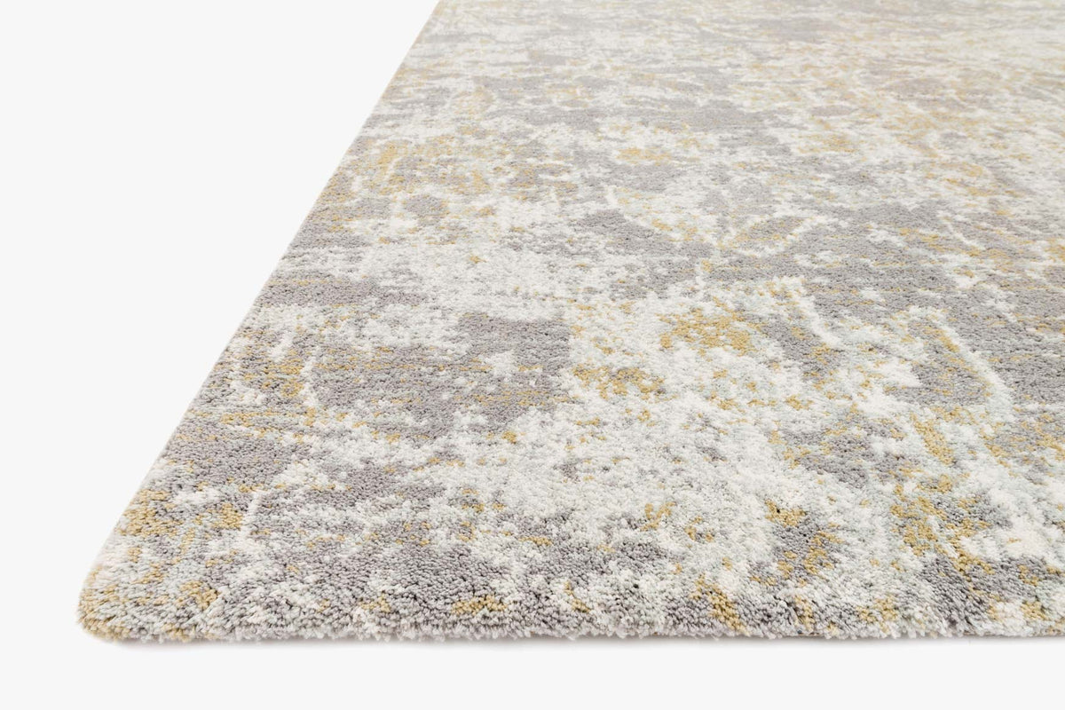 Rectangular area rug with gray, beige, and light yellow abstract motif and low pile