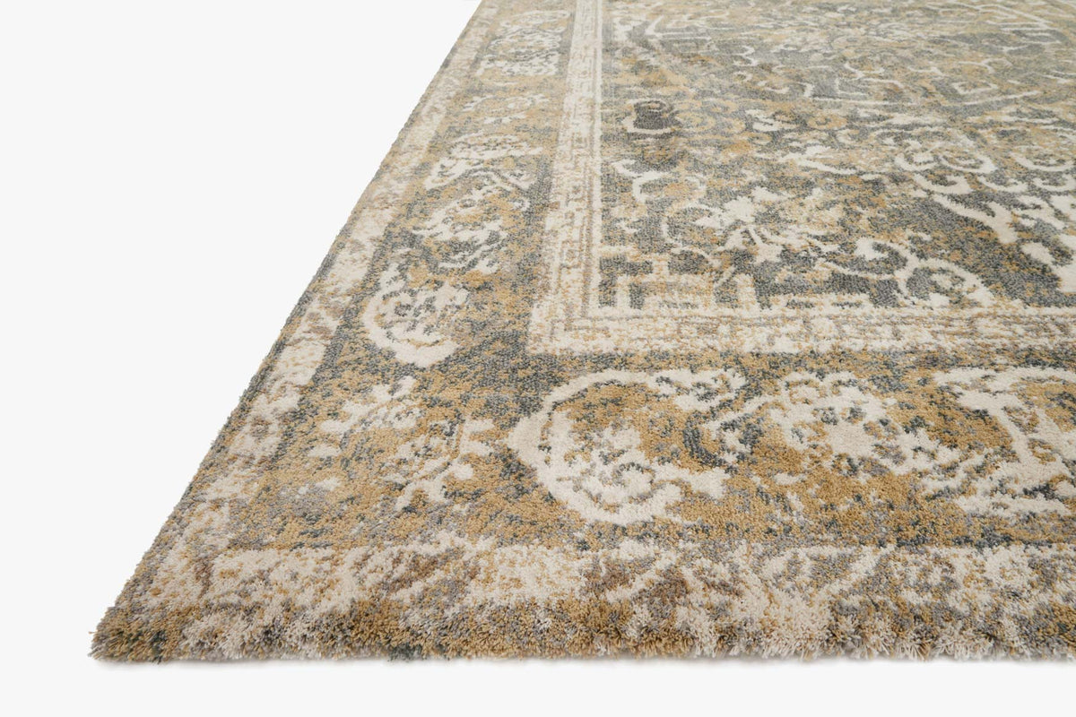 Transitional power-loomed rug corner with distressed beige and grey geometric pattern