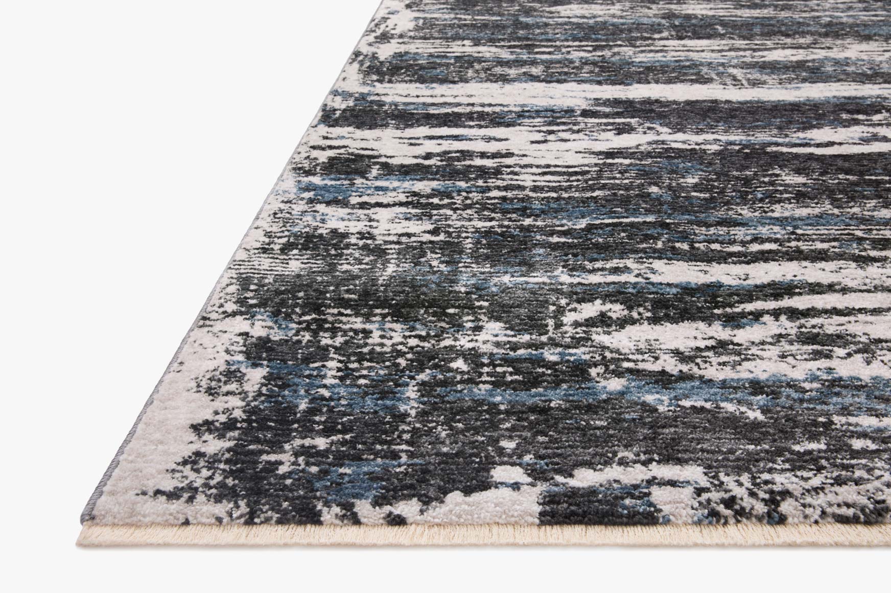 Corner view of charcoal and dove power-loomed rug with distressed linear pattern.