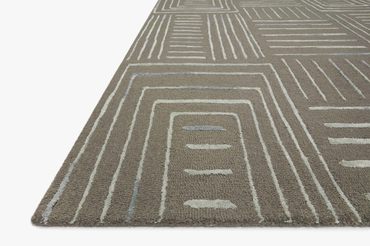 Grey and mist geometric rug corner with concentric line square motif