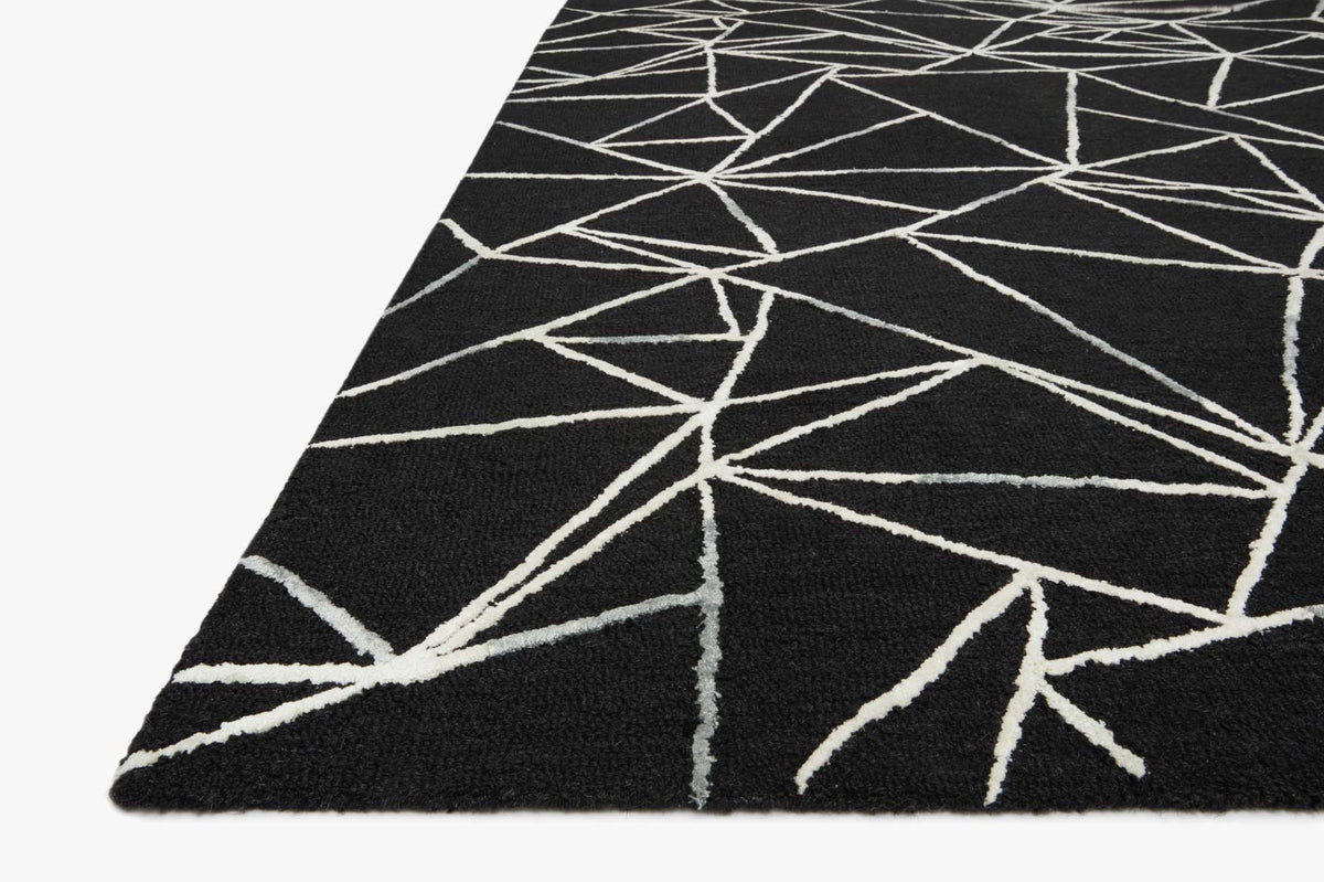 Black geometric hand-tufted rug with ivory linework, diagonal corner detail