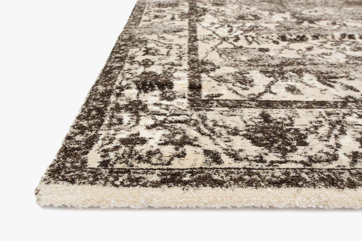 Contemporary power-loomed rug corner view, distressed pattern in mocha and ivory