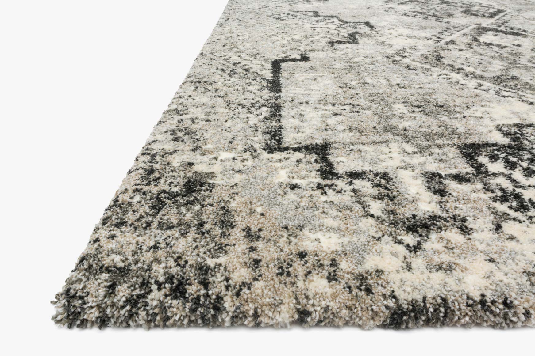 Grey-and-black power-loomed rug edge with short shag pile and abstract speckled pattern