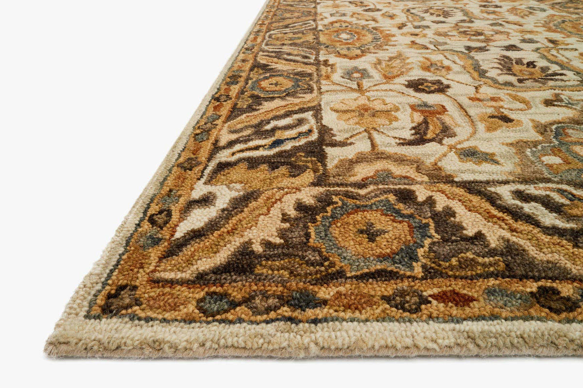 Traditional hooked rug corner, ivory and dark taupe with detailed floral and medallion motif.