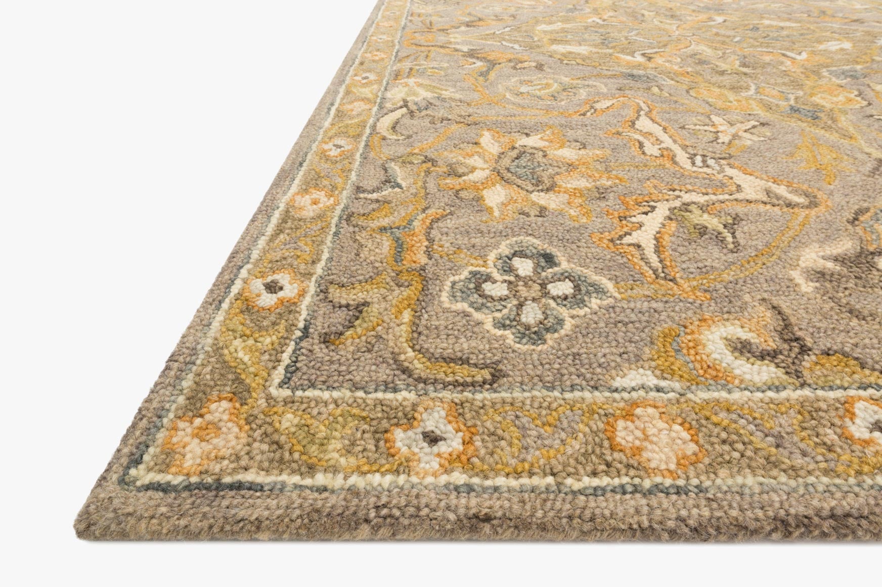 Traditional hooked rug corner detail, grey pile with yellow and cream pattern