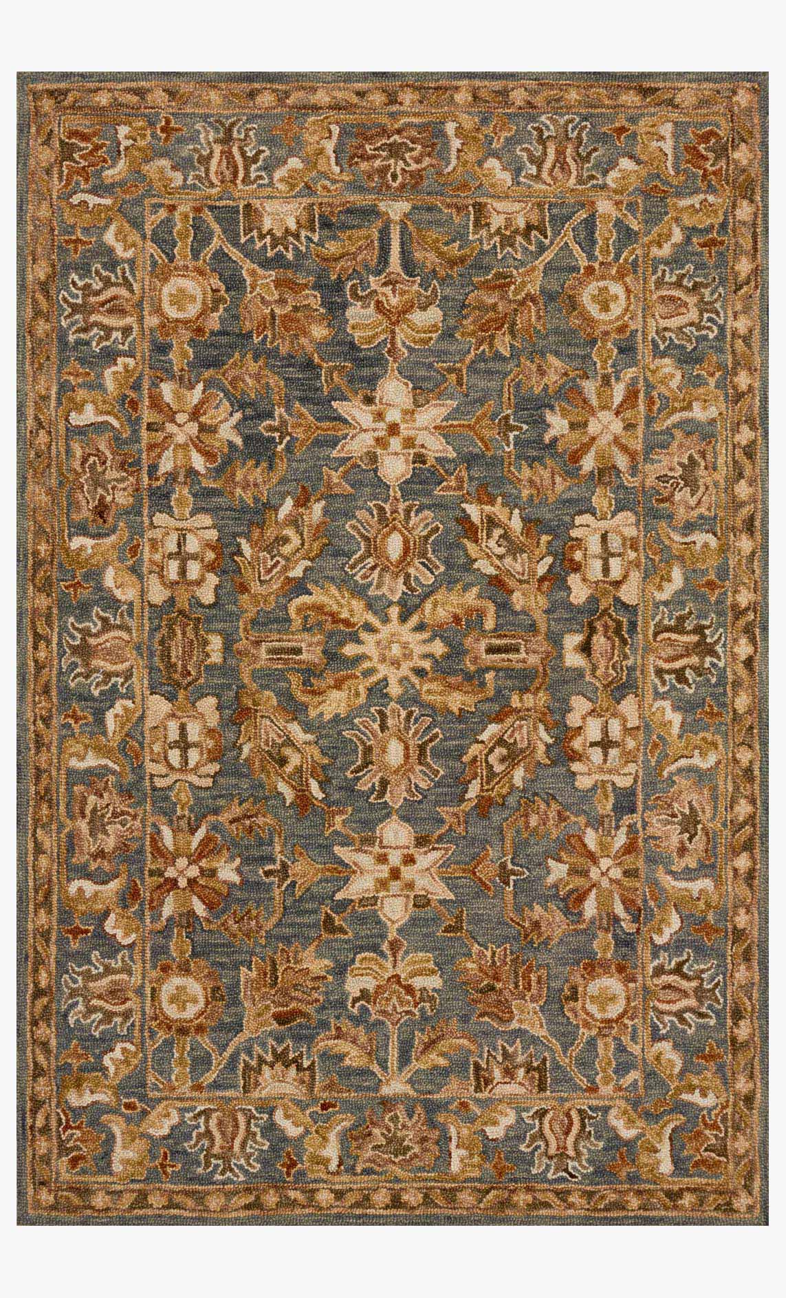 Traditional hooked rug with ornate slate and rust floral pattern, bordered edges