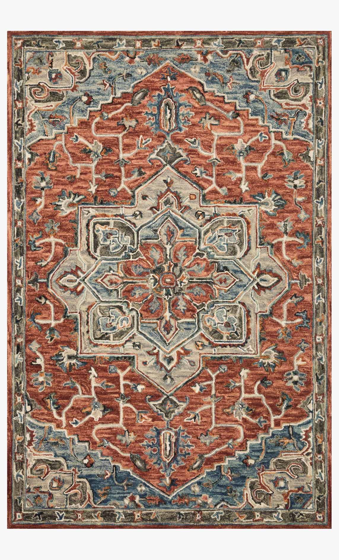 Traditional hooked rug with red, rust, and teal geometric medallion center