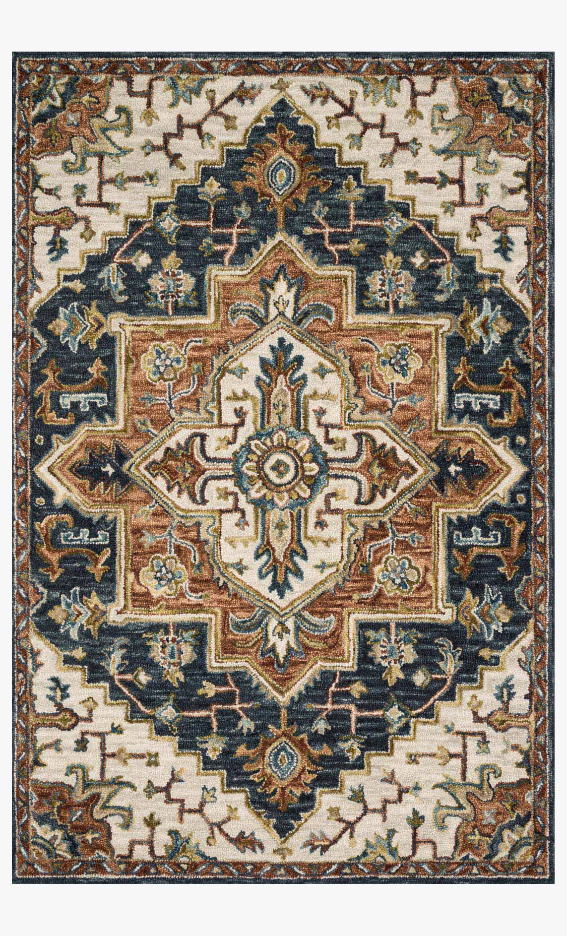 Traditional blue hooked rug with central medallion and geometric border, tan and rust