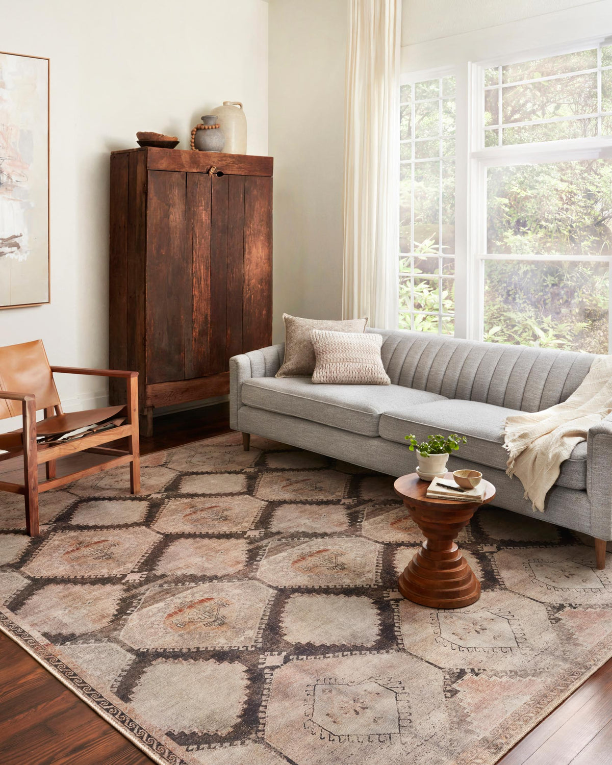 Traditional power-loomed rug, distressed geometric squares and diamonds in gray and blush