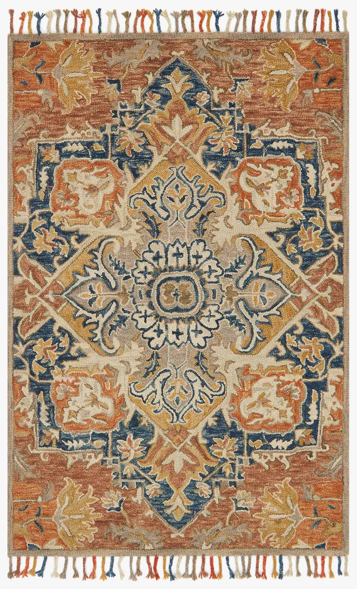 Transitional hooked rug with rust and blue medallion pattern and fringe edges