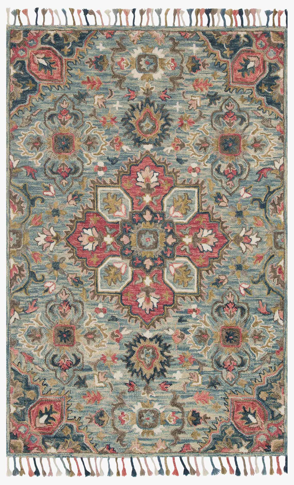 Light blue hooked area rug with multicolor floral medallion pattern and fringe tassels