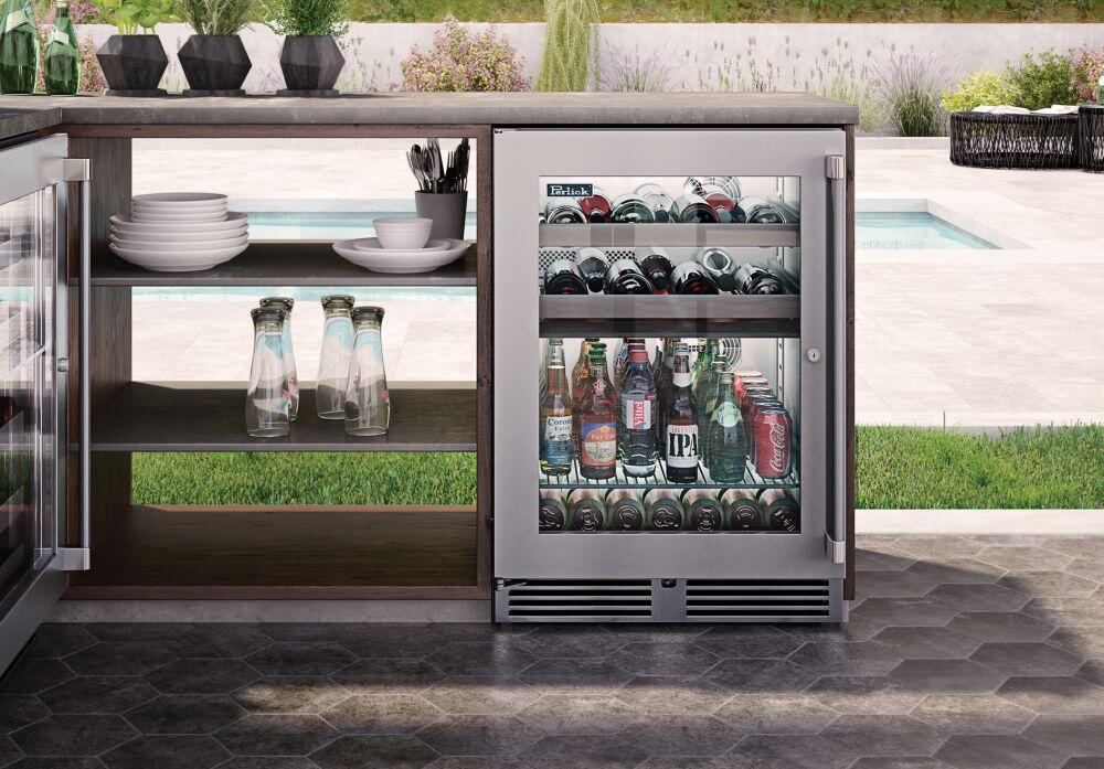 Perlick outdoor beverage center with open glass door and stainless interior, stocked bottles