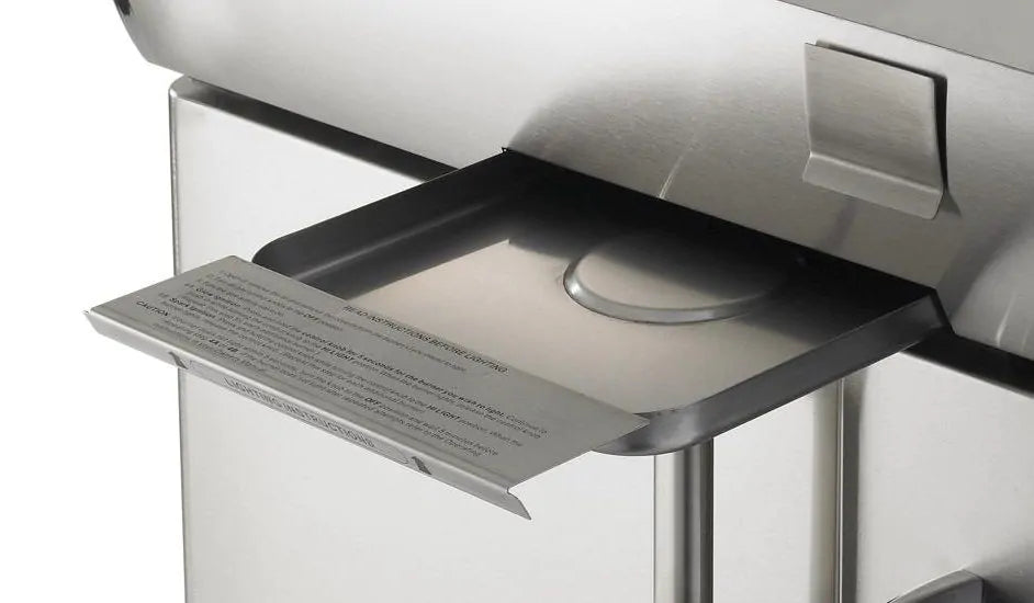 Built-in gas grill drip tray with hinged lid and label plate
