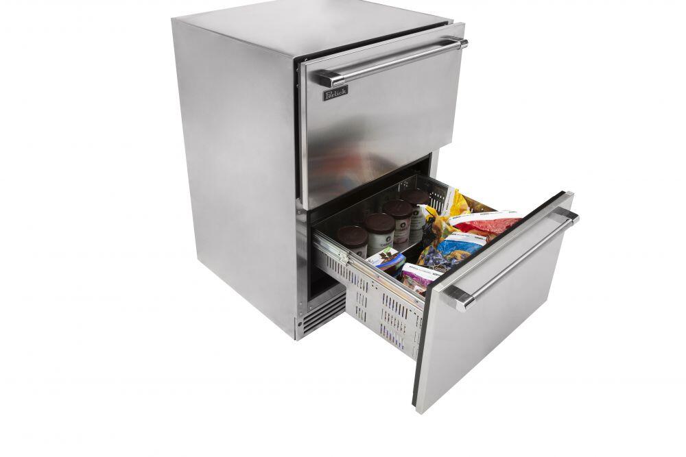 Open stainless steel compact freezer drawer with baskets and stored food