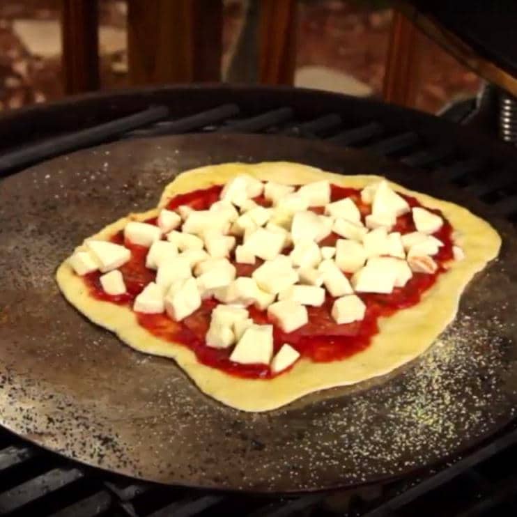 15-inch stainless steel cooking plate with topped flatbread cooking