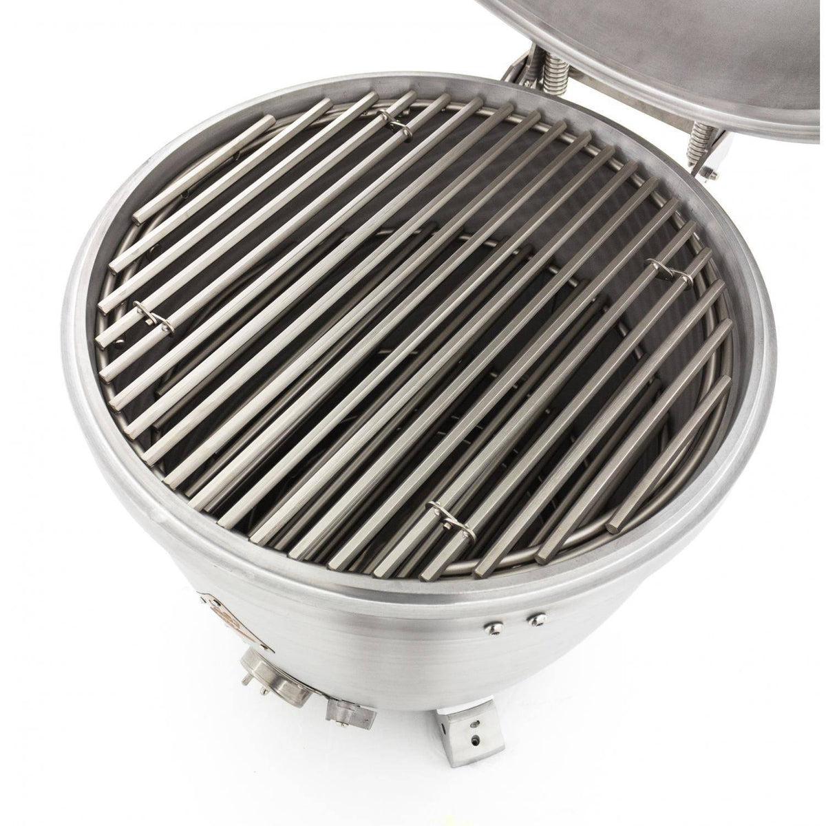 Kamado grill with lid open showing black grate and stainless control knobs