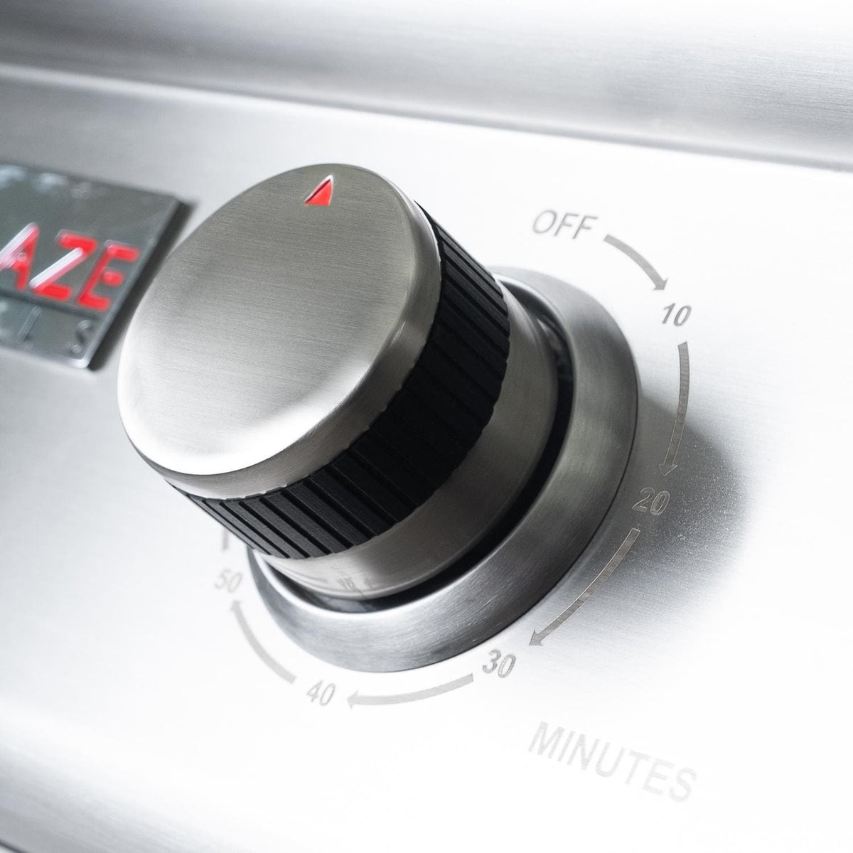 Electric grill timer control knob with OFF marking and minutes scale on panel