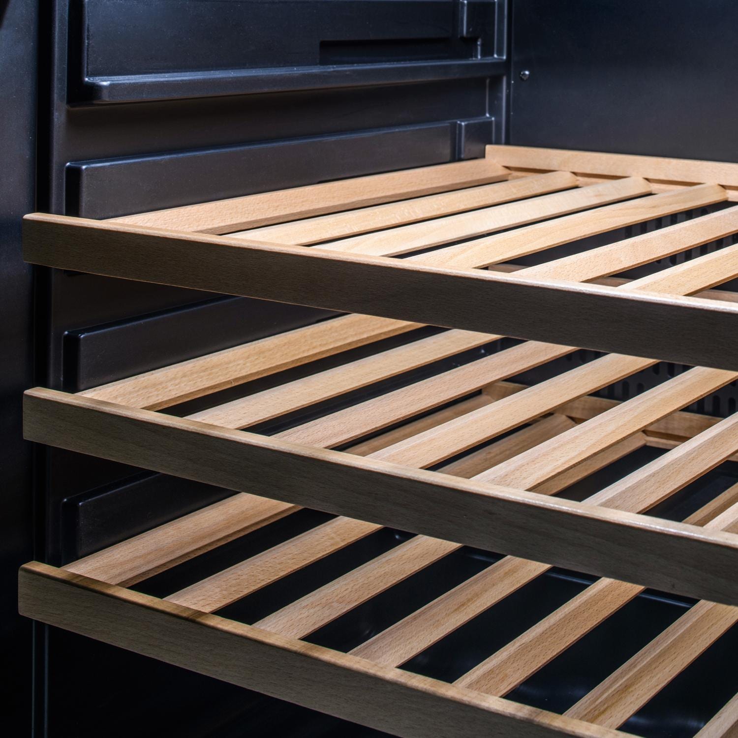 Wooden warming rack with slatted grate inside stainless grill