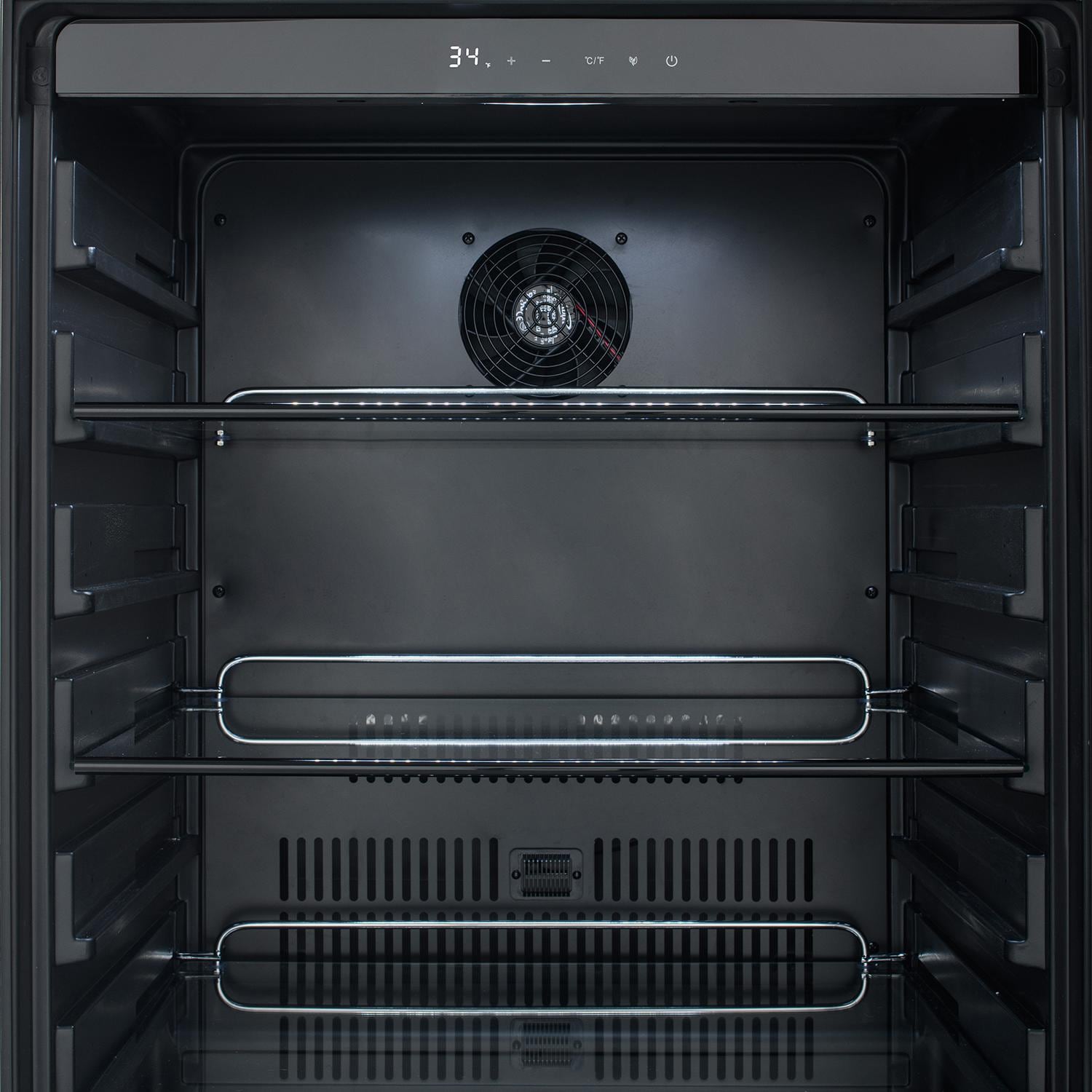 Open refrigerator with top fan and wire shelves for storing beverages