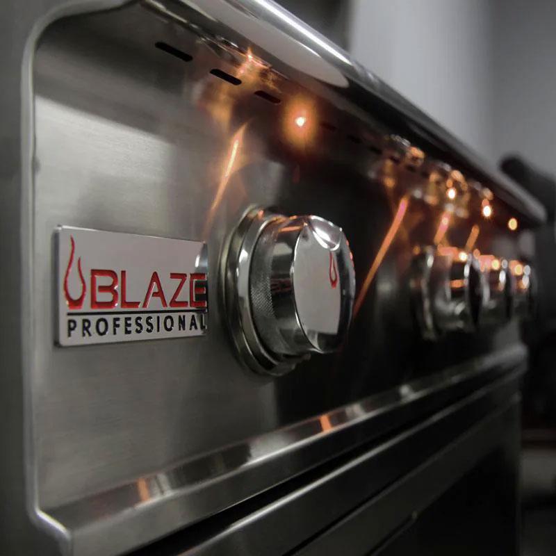 Stainless steel control dial area with Blaze Professional logo and amber LED glow