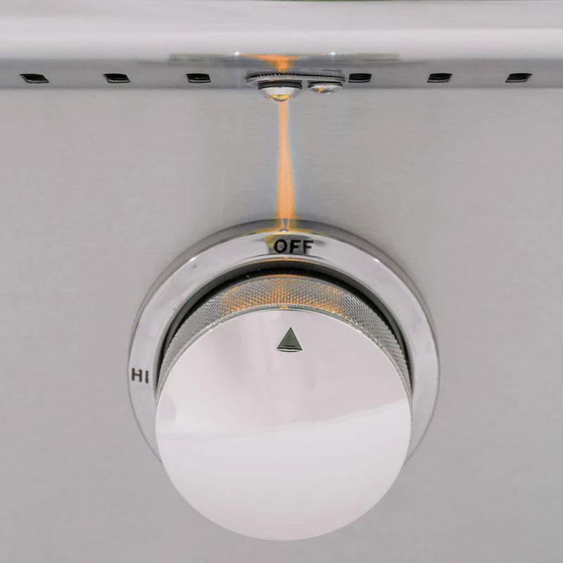 Grill temperature knob showing OFF position with amber LED indicator light