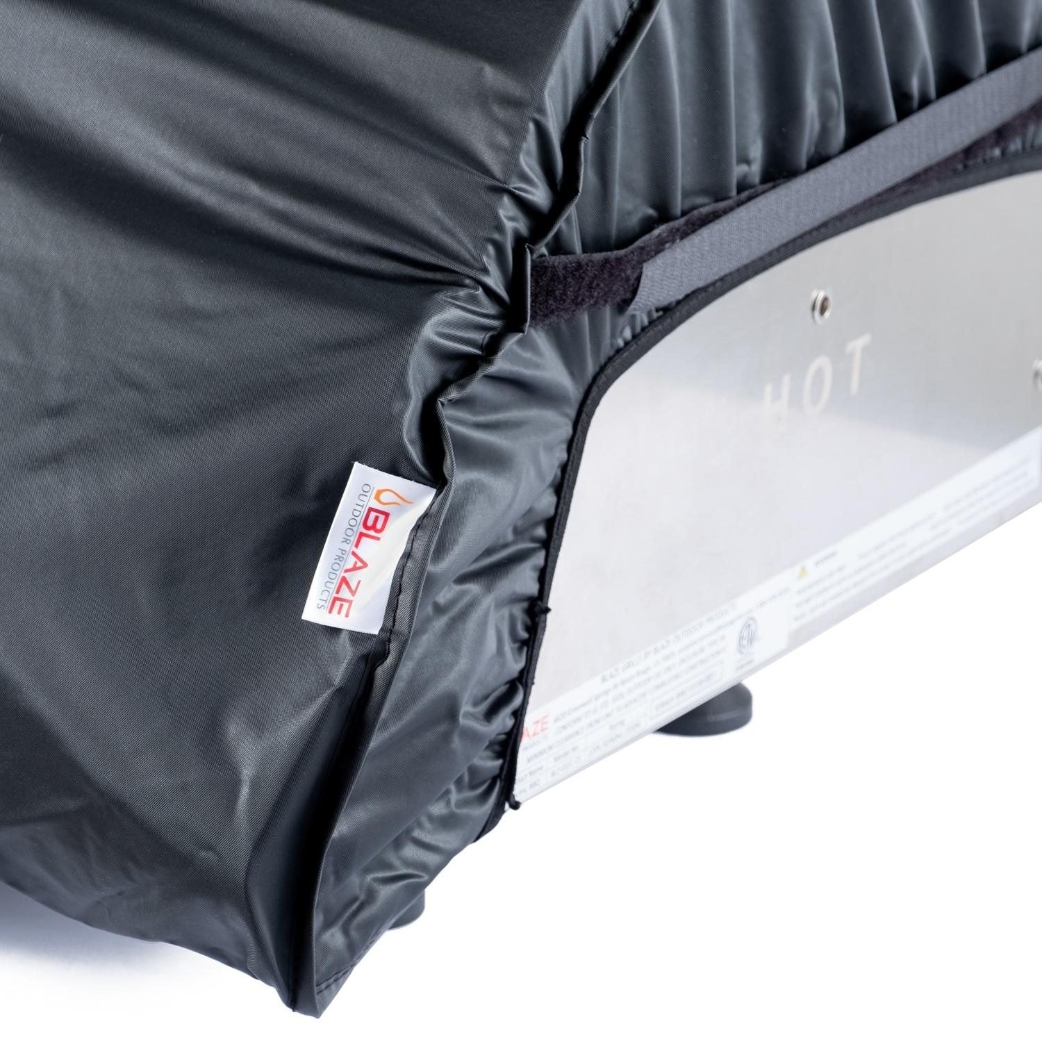 Dark gray grill cover corner with label and underside panel