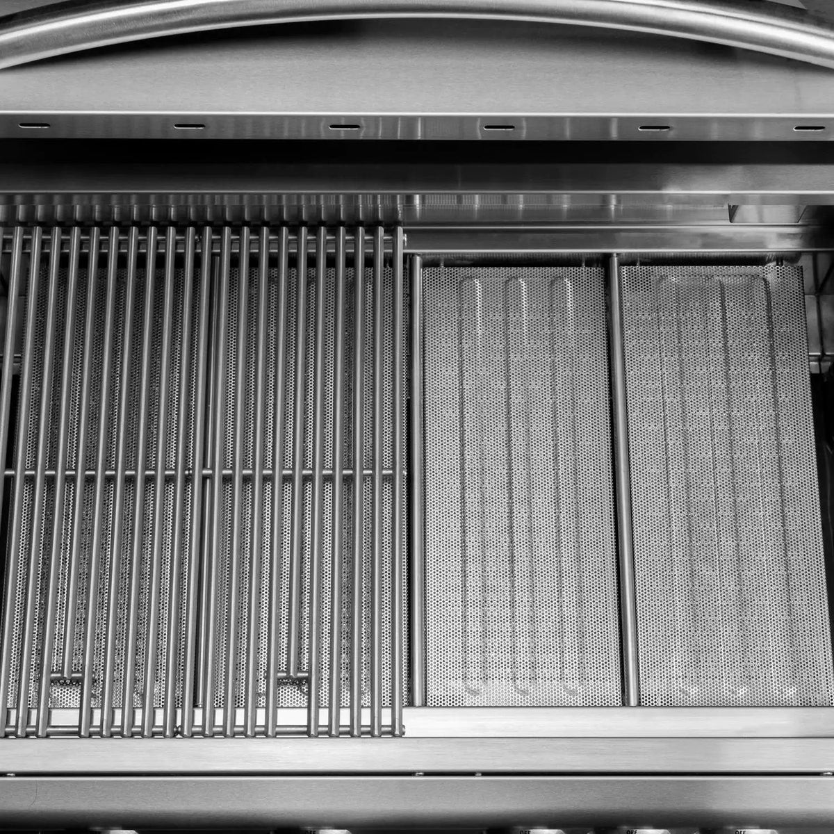Flame tamer insert panels with perforated surface next to burner tubes