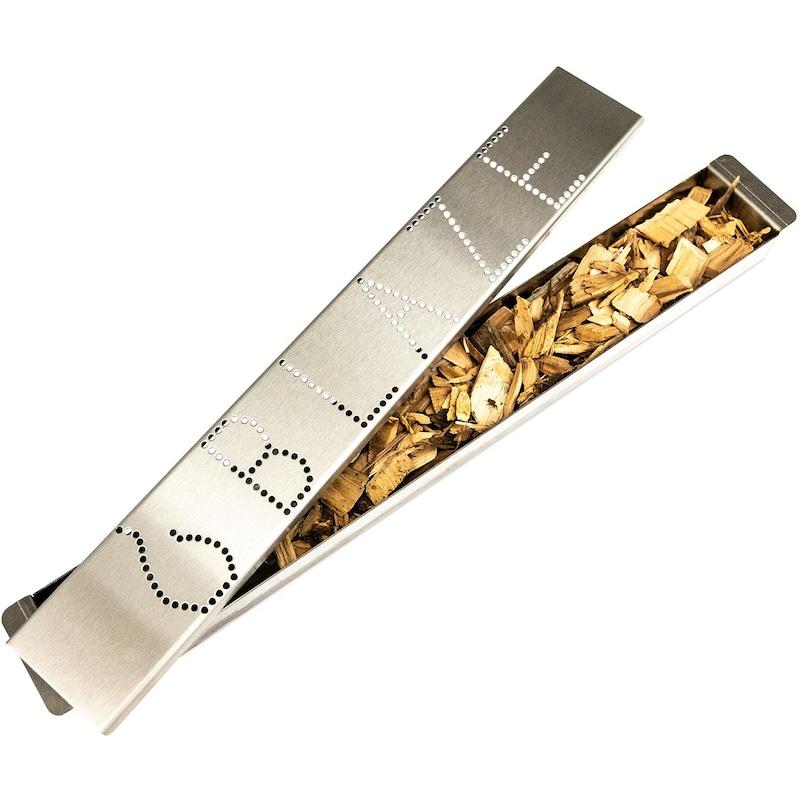 Portable stainless smoker box open with wood chips on a perforated dotted insert
