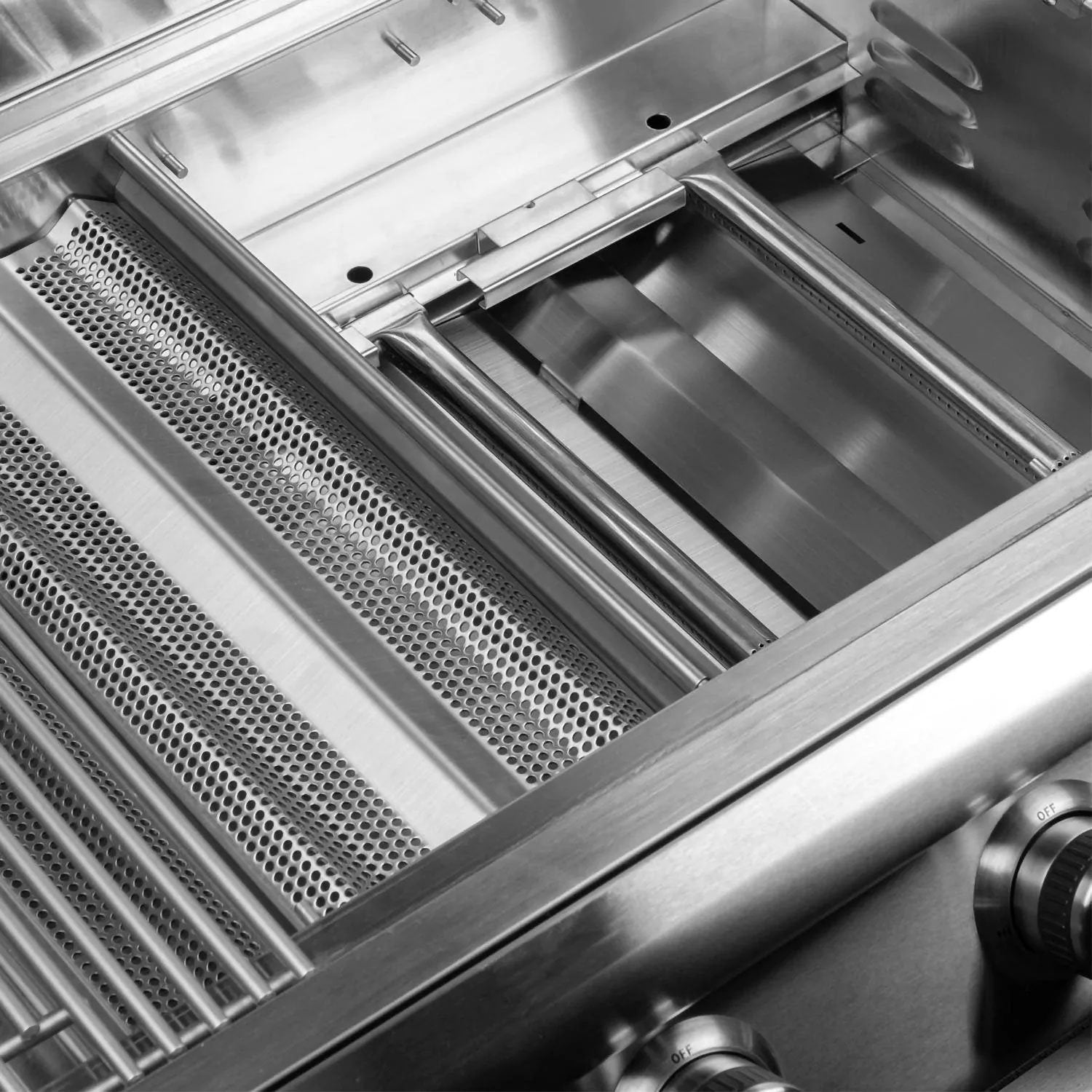 Stainless steel grill interior with perforated heat shield and burner tubes