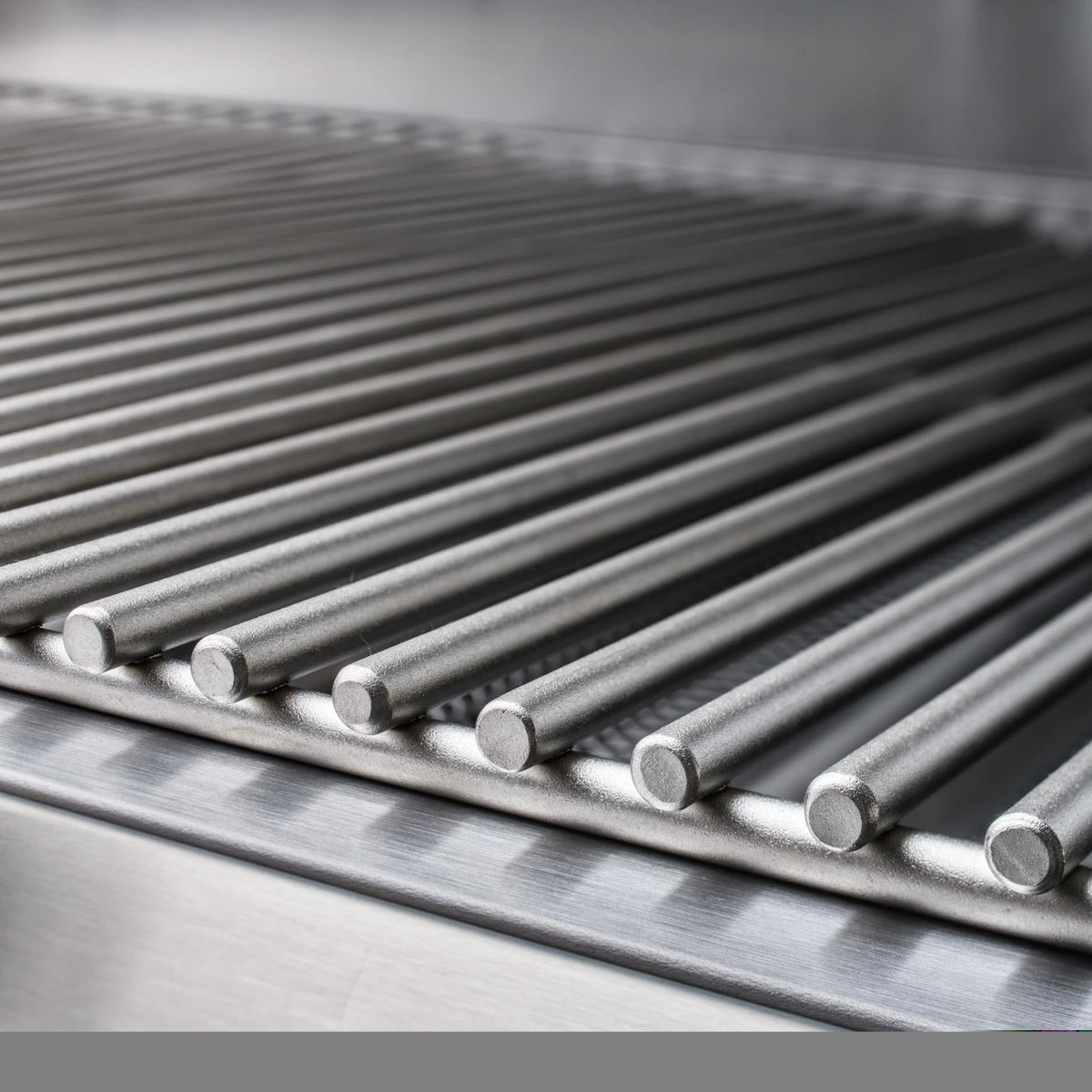 Close-up of stainless steel tube cooking grates with rounded ends