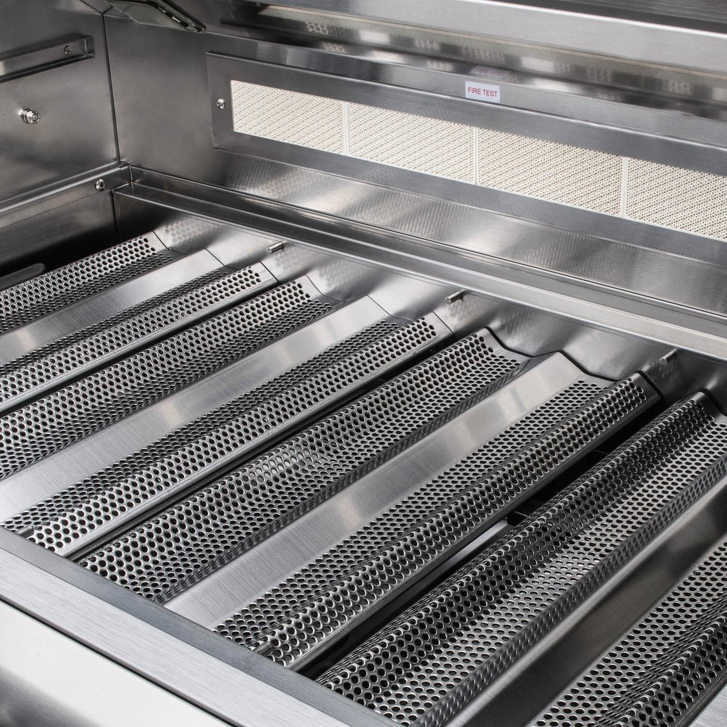 Built-in natural gas grill firebox with perforated stainless burner covers