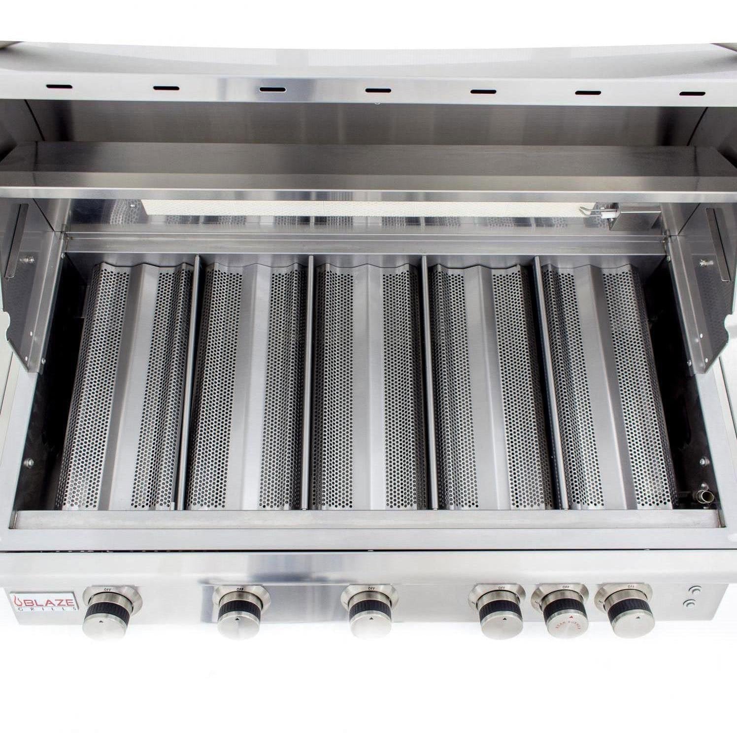 Open grill firebox with radiant burner tubes and perforated burner surfaces