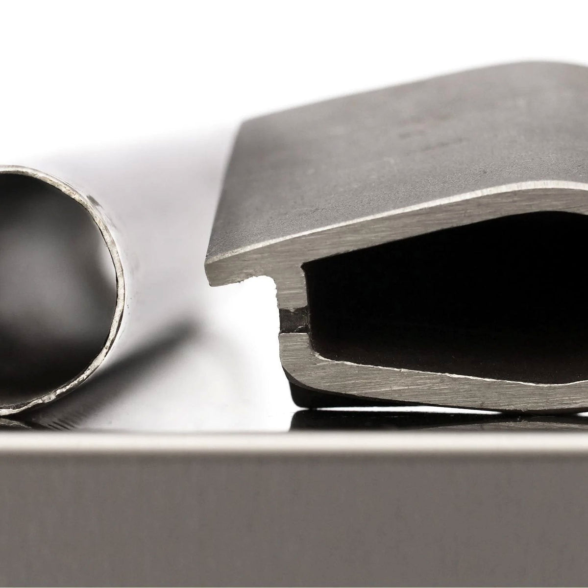 Stainless steel gas grill burner head and gas port close-up