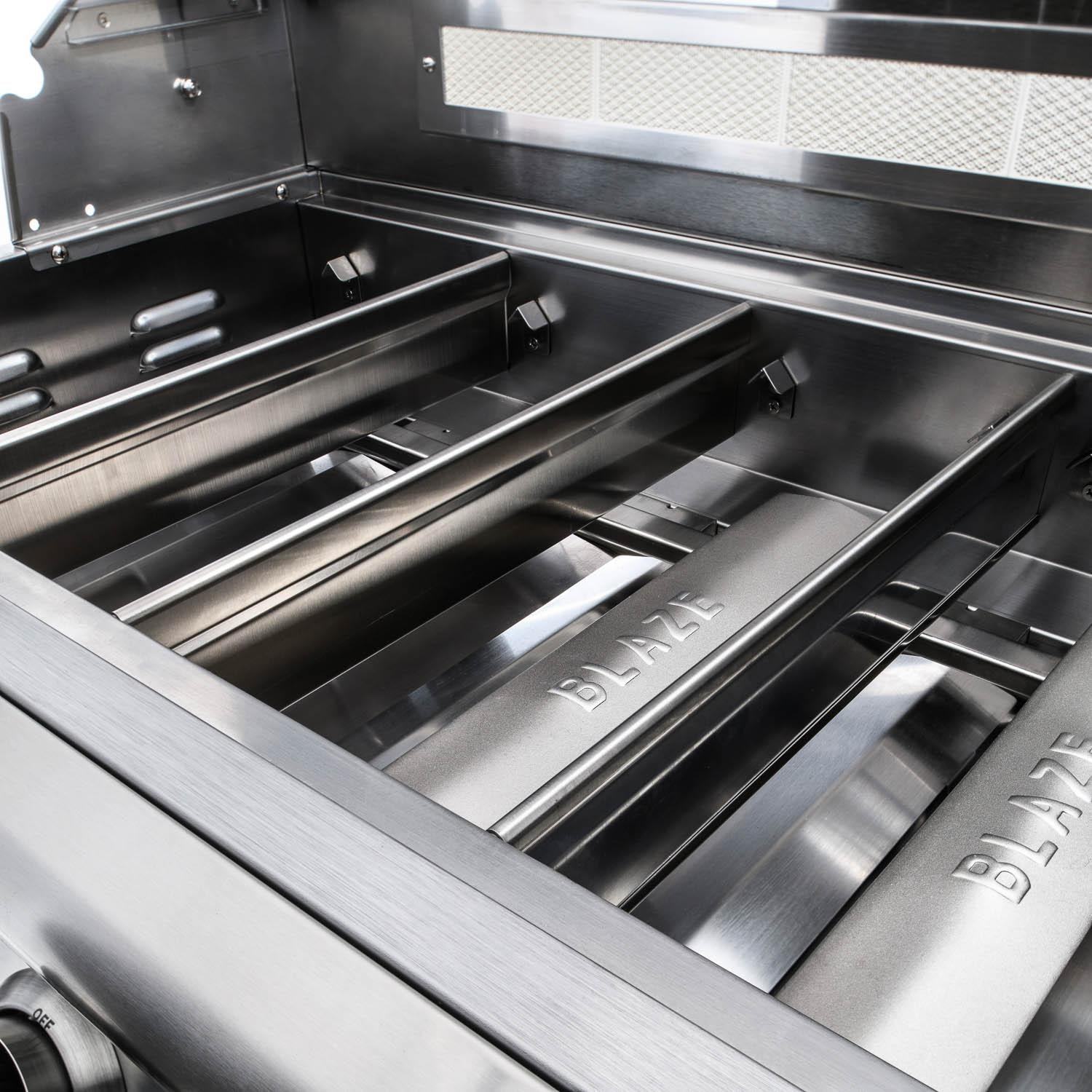 Stainless grill cooking area with Blaze branding on flavorizer bars