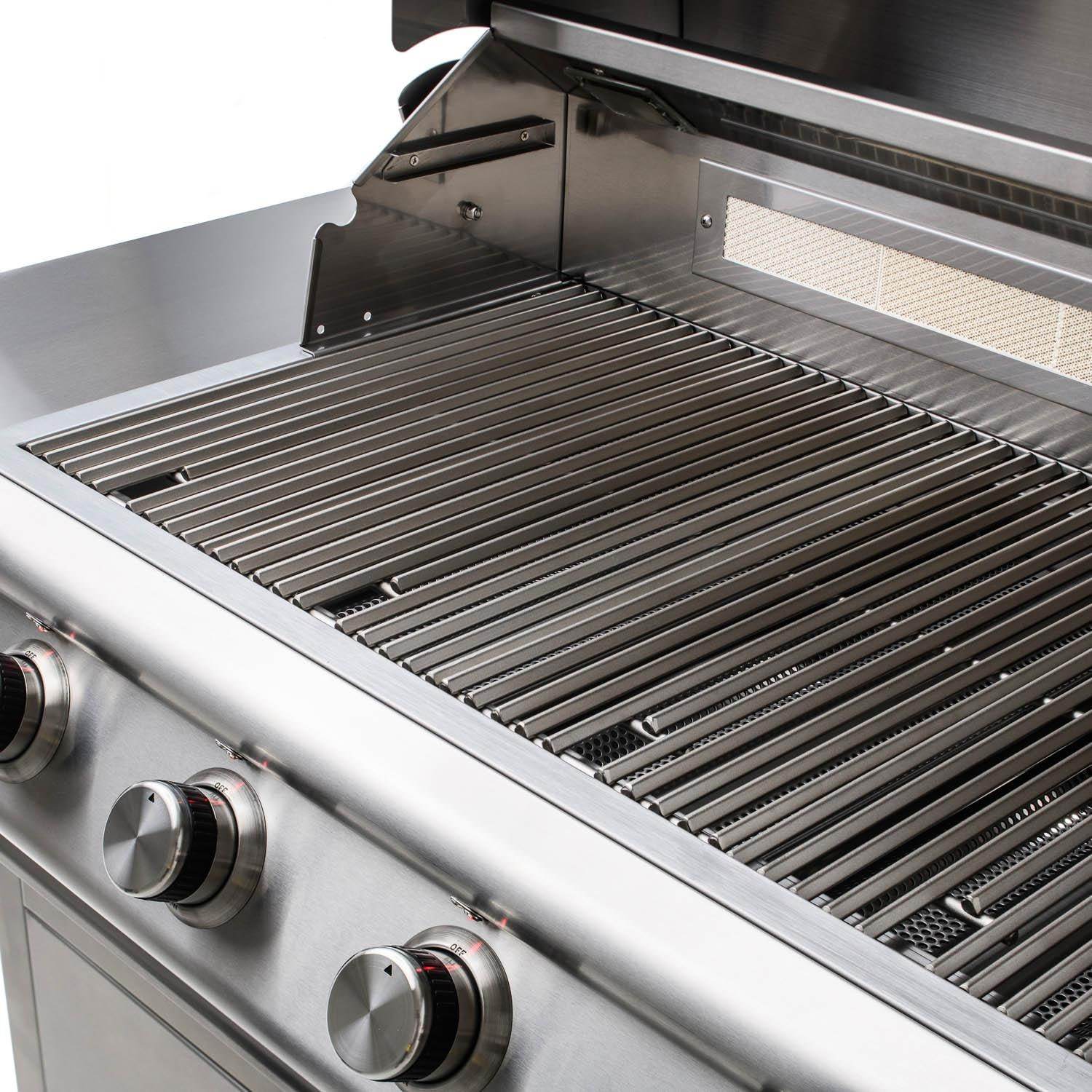 Stainless grill grates inside open hood with burner guard and metal back panel